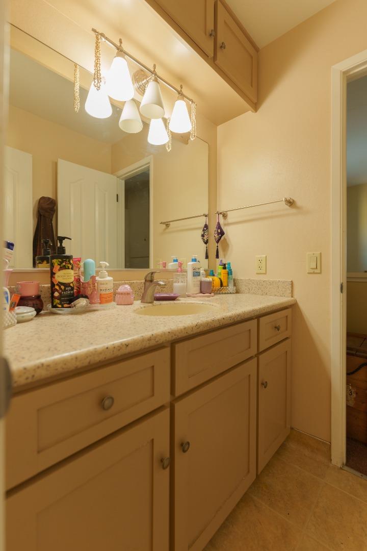19308 Creekside Circle Salinas, CA 93908 - Photo 13 of 21 a bathroom with a sink and a mirror