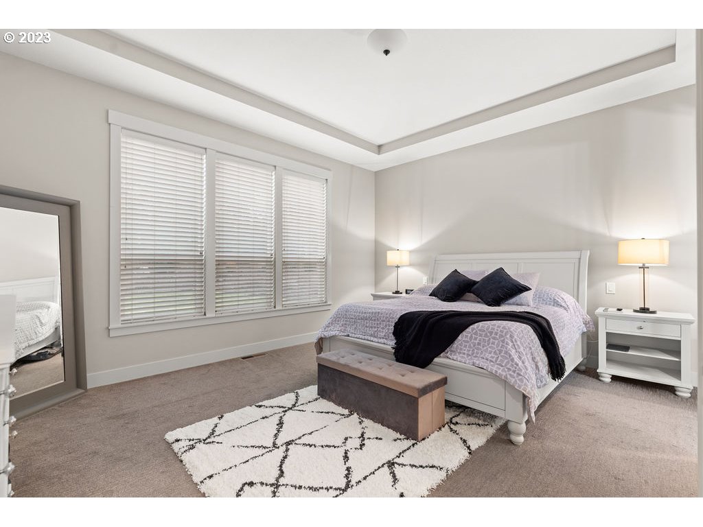 4501 Northwest 122nd Street Vancouver, WA 98685 - Photo 11 of 28 a bedroom with a bed a couch and next to a window