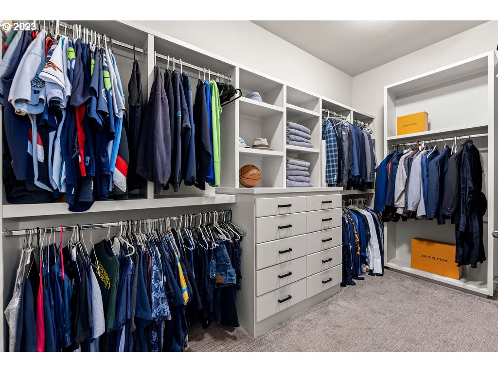 4501 Northwest 122nd Street Vancouver, WA 98685 - Photo 14 of 28 a view of walk in closet with clothes and shoes