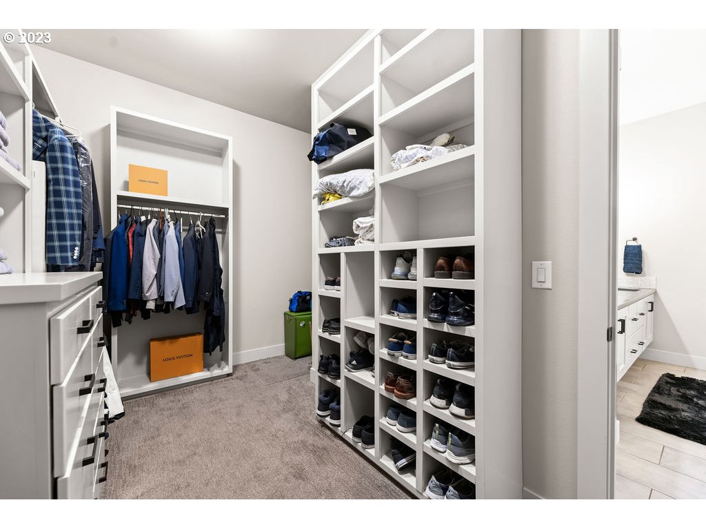 4501 Northwest 122nd Street Vancouver, WA 98685 - Photo 15 of 28 a view of walk in closet with clothes and shoes