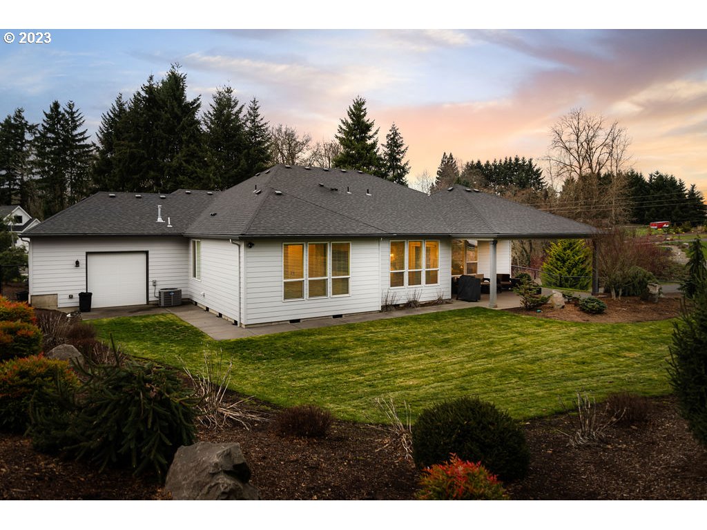 4501 Northwest 122nd Street Vancouver, WA 98685 - Photo 26 of 28 a view of a big house with a big yard and potted plants