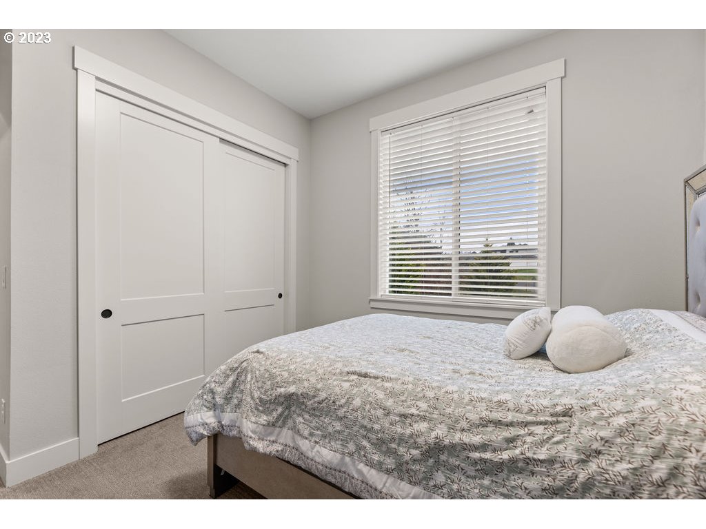 4501 Northwest 122nd Street Vancouver, WA 98685 - Photo 8 of 28 a bedroom with a bed and a window