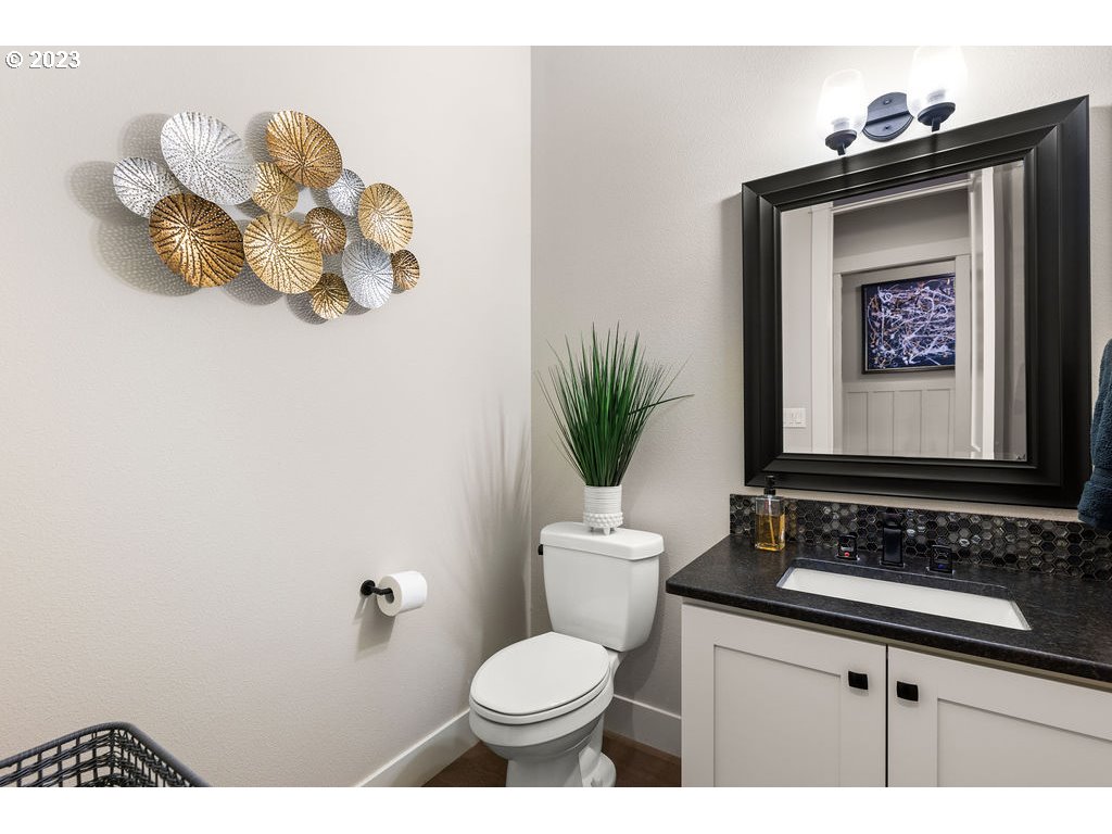 4501 Northwest 122nd Street Vancouver, WA 98685 - Photo 10 of 28 a bathroom with a toilet sink and mirror