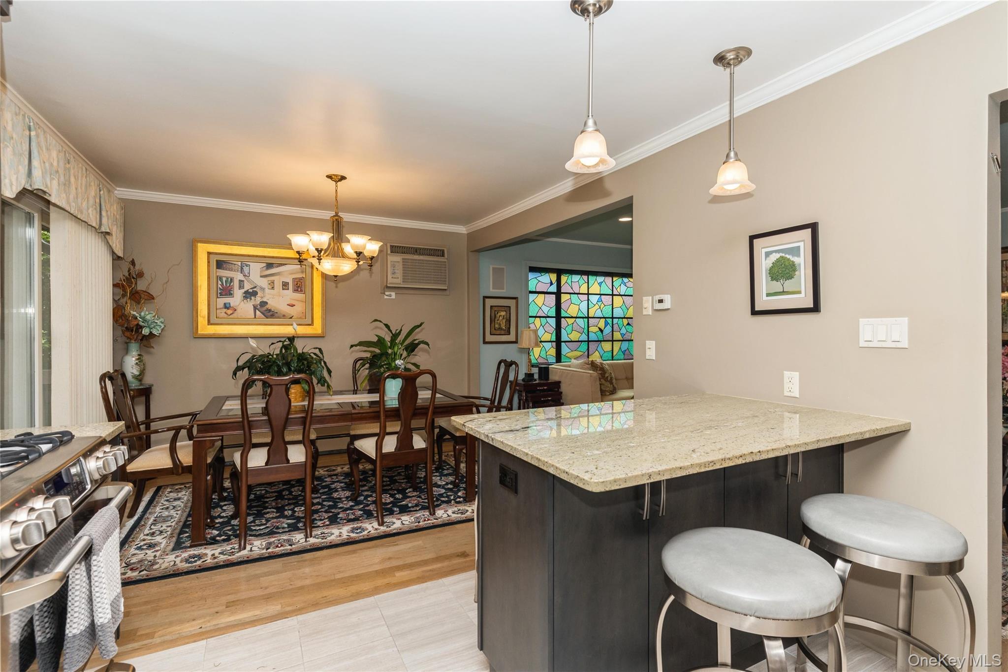 2772 Riverside Avenue Merrick, NY 11566 - Photo 6 of 45 a view of a dining room with furniture and a chandelier