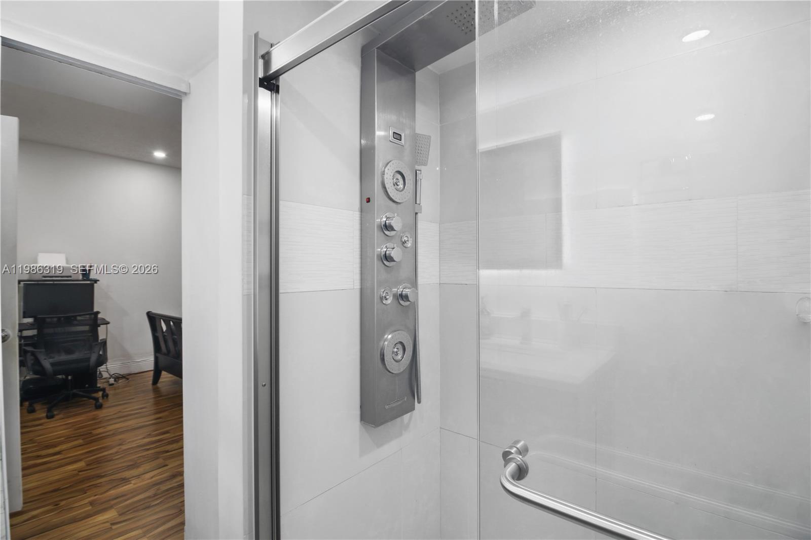 10135 Southwest 139th Place Miami, FL 33186 - Photo 12 of 25 a bathroom with a shower