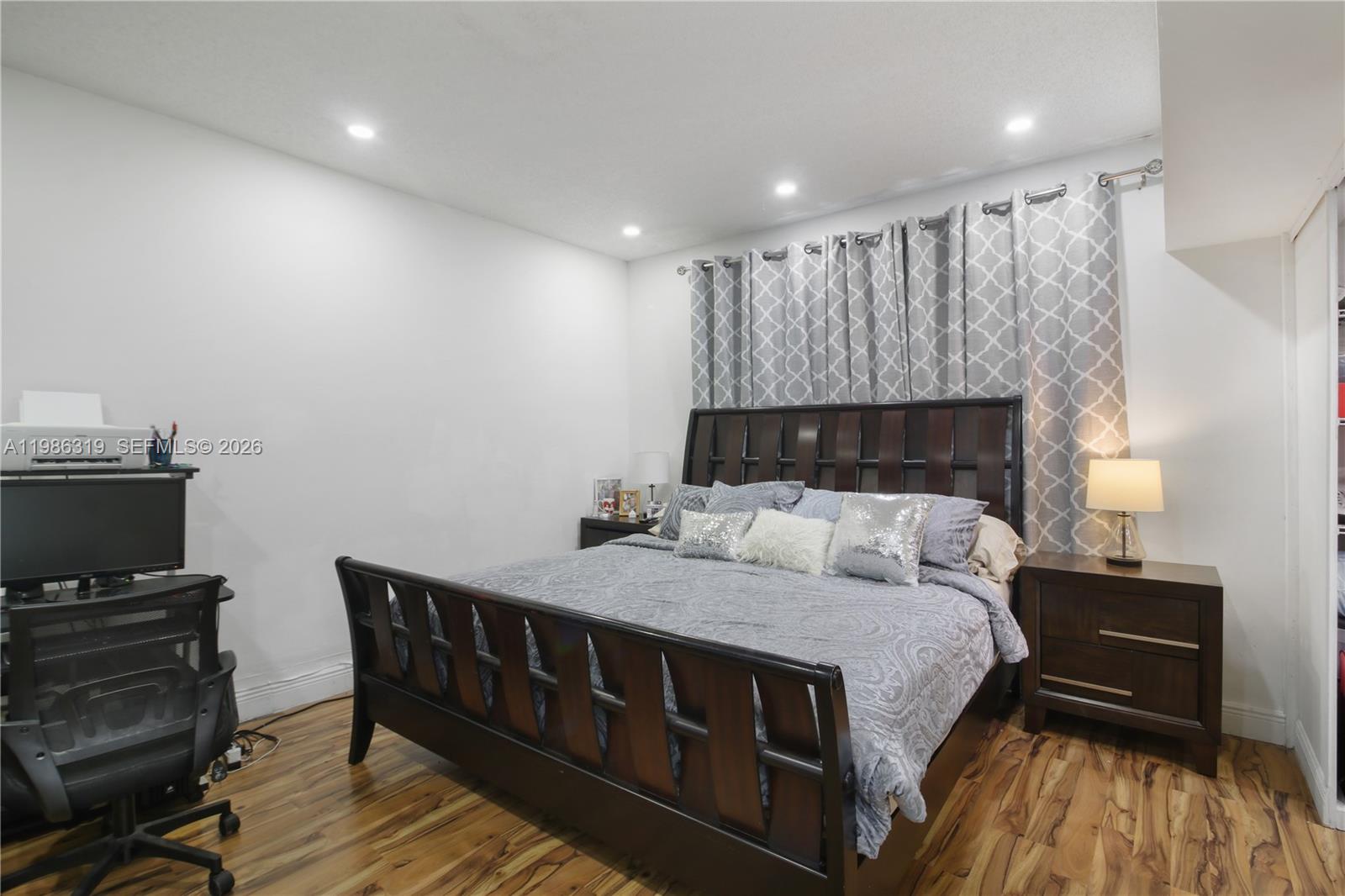 10135 Southwest 139th Place Miami, FL 33186 - Photo 13 of 25 a bed room with a bed and a television