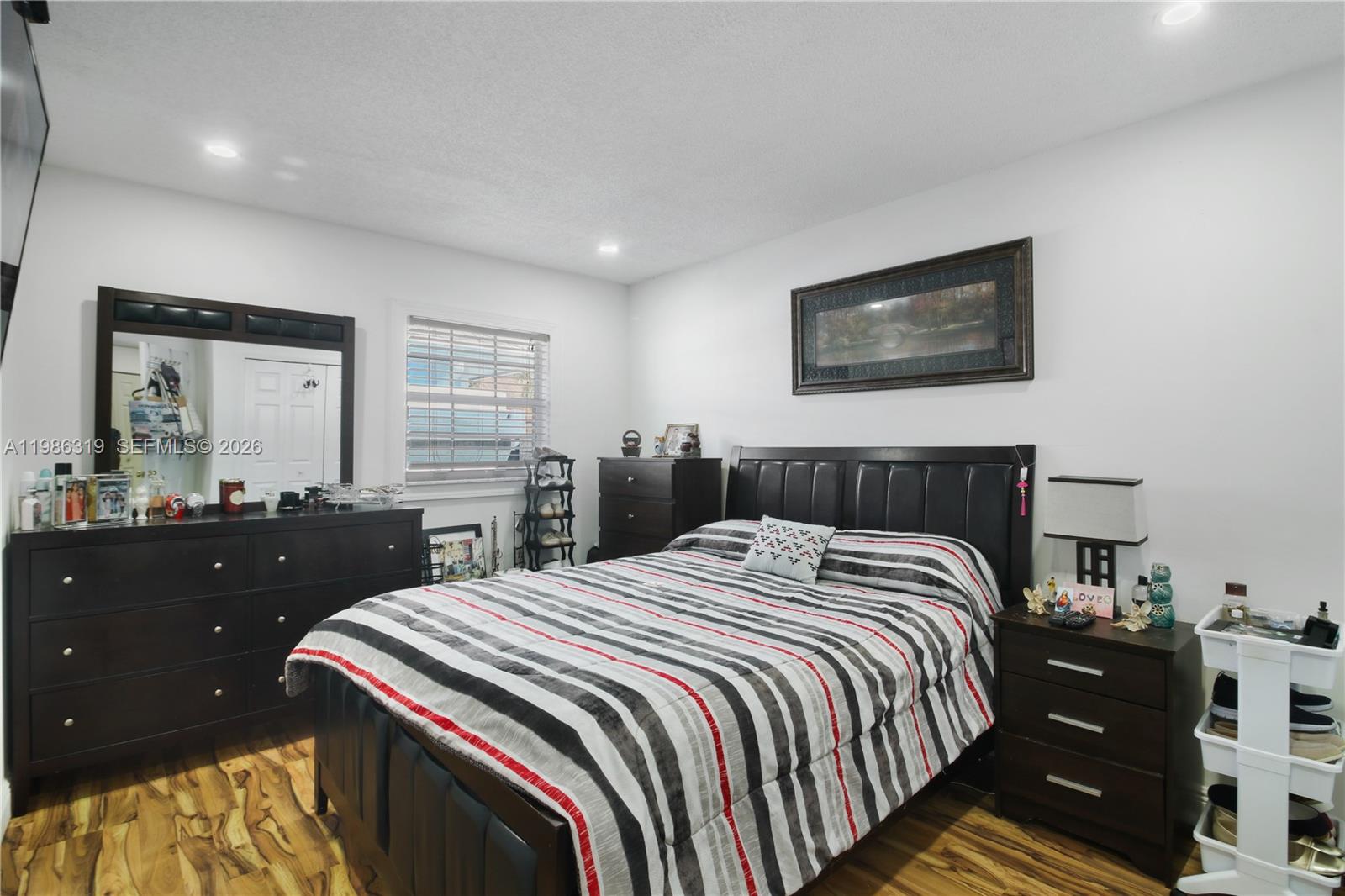 10135 Southwest 139th Place Miami, FL 33186 - Photo 15 of 25 a bedroom with a bed and a dresser