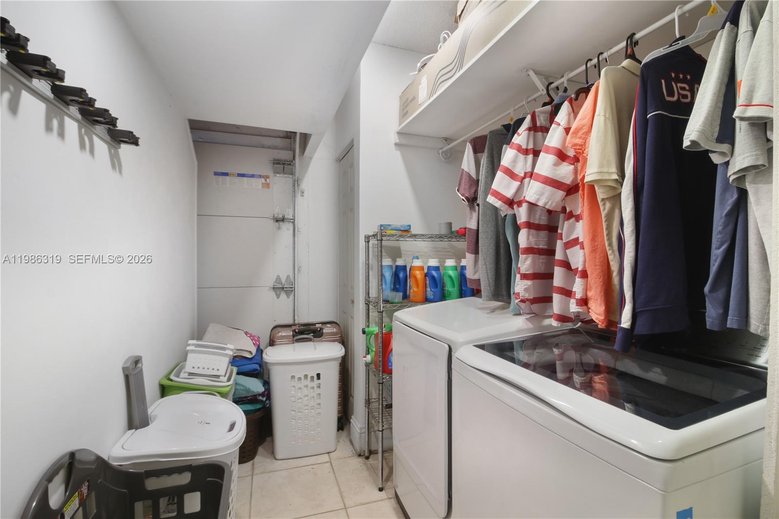 10135 Southwest 139th Place Miami, FL 33186 - Photo 22 of 25 a utility room with dryer and washer