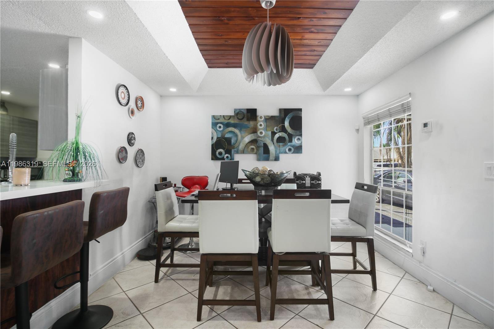 10135 Southwest 139th Place Miami, FL 33186 - Photo 10 of 25 a dining room with furniture and window