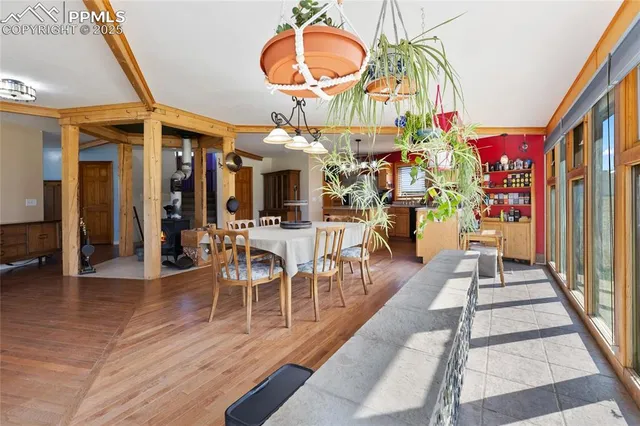 an entryway with a dining room and chandelier