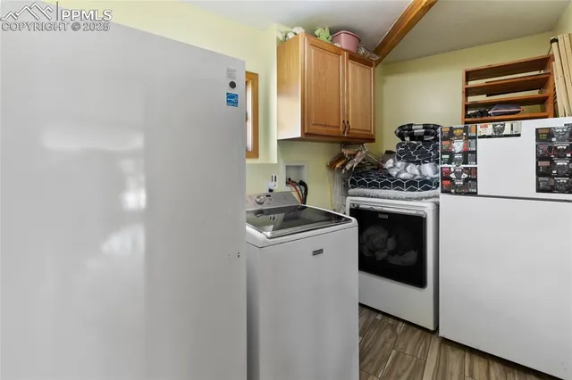 a kitchen with a stove and a refrigerator
