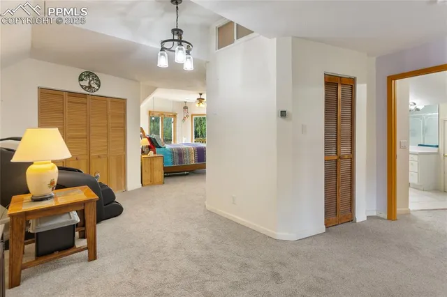 a view of living room and bedroom with furniture