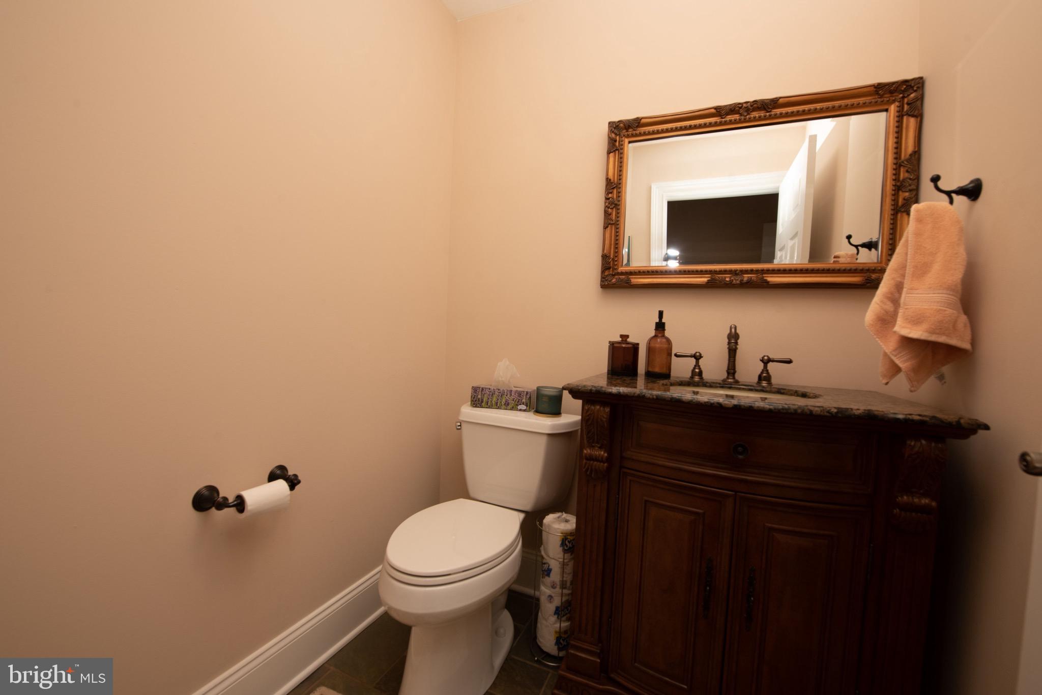3450 Woodward Road Huntingdon Valley, PA 19006 - Photo 48 of 54 a bathroom with a toilet a sink and mirror