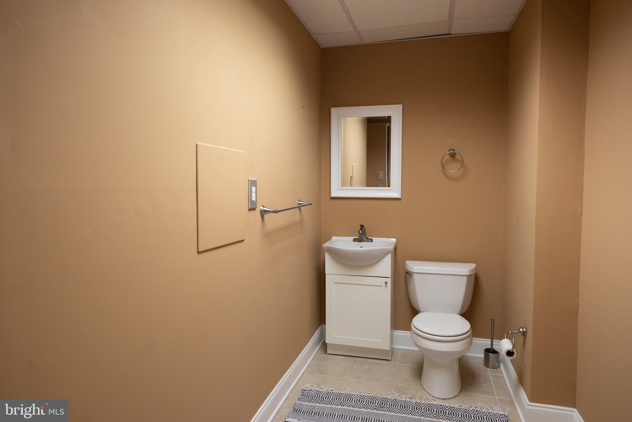 3450 Woodward Road Huntingdon Valley, PA 19006 - Photo 51 of 54 a white toilet sitting next to a bathroom sink