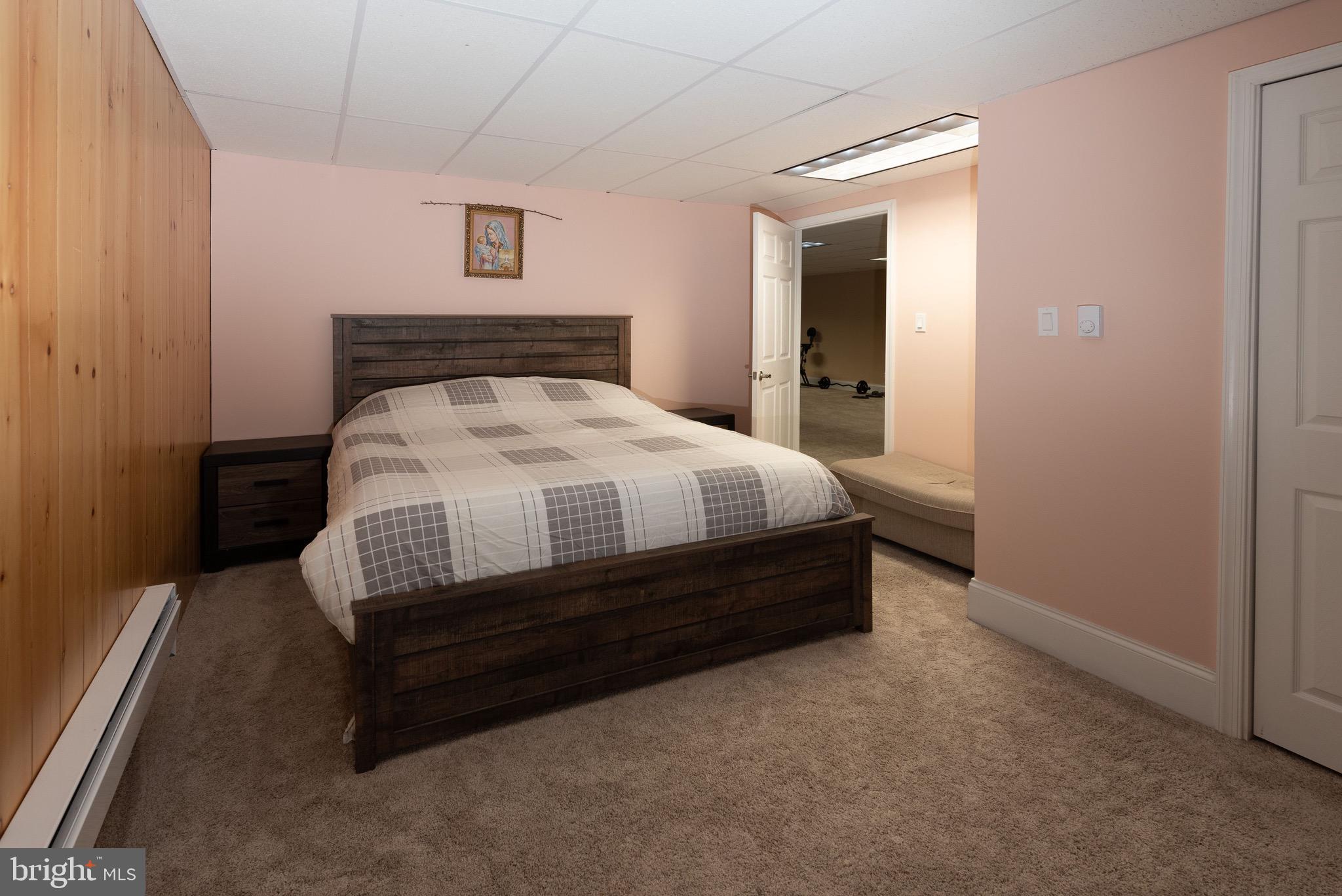 3450 Woodward Road Huntingdon Valley, PA 19006 - Photo 52 of 54 a bedroom with a bed and a mirror