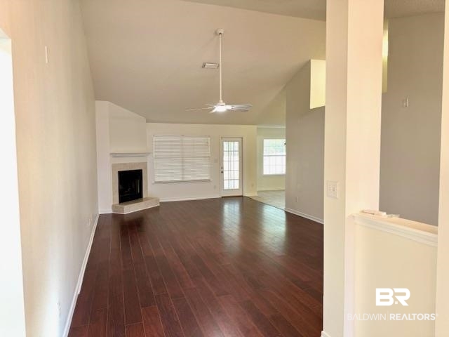 27948 Rileywood Drive Daphne, AL 36526 - Photo 5 of 22 living room featuring a fireplace, dark wood-type flooring, and lofted ceiling