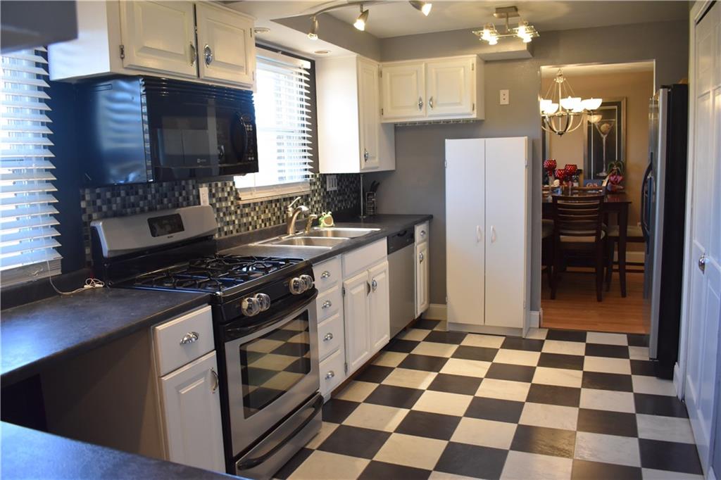 3858 Edge Road Pittsburgh, PA 15227 - Photo 7 of 23 Kitchen- Updated backspash, lighting, counters, and Stainless Steel Appliances