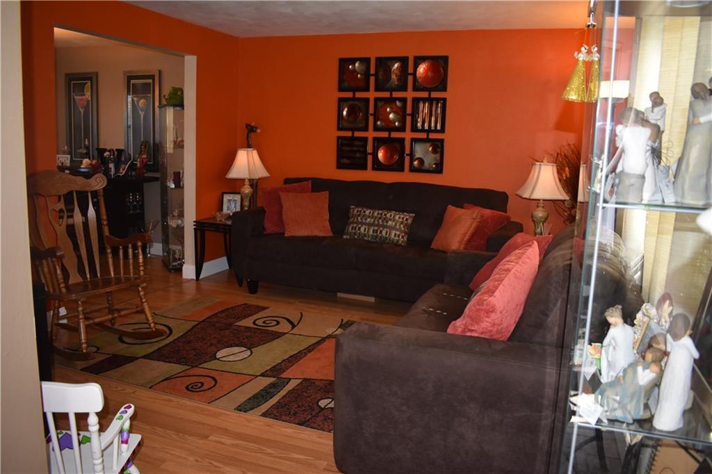 3858 Edge Road Pittsburgh, PA 15227 - Photo 10 of 23 Living Room with New Flooring, which opens to the Dining Room
