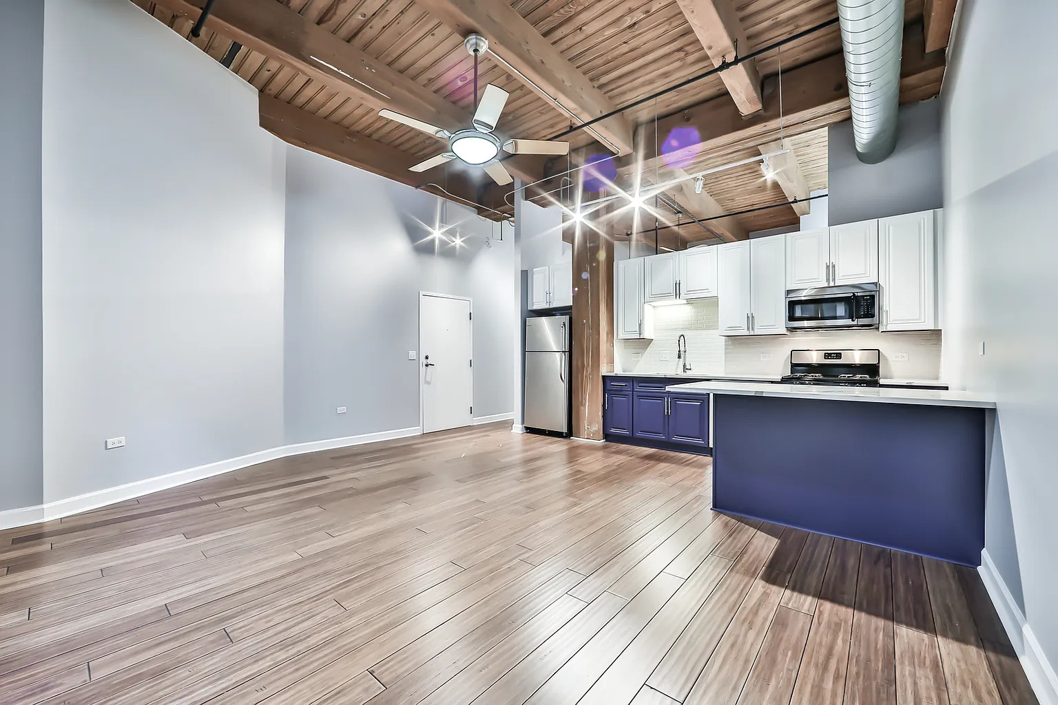1500 West Monroe Street, Unit 206 Chicago, IL 60607 - Photo 4 of 7 a view of kitchen with sink and wooden floor