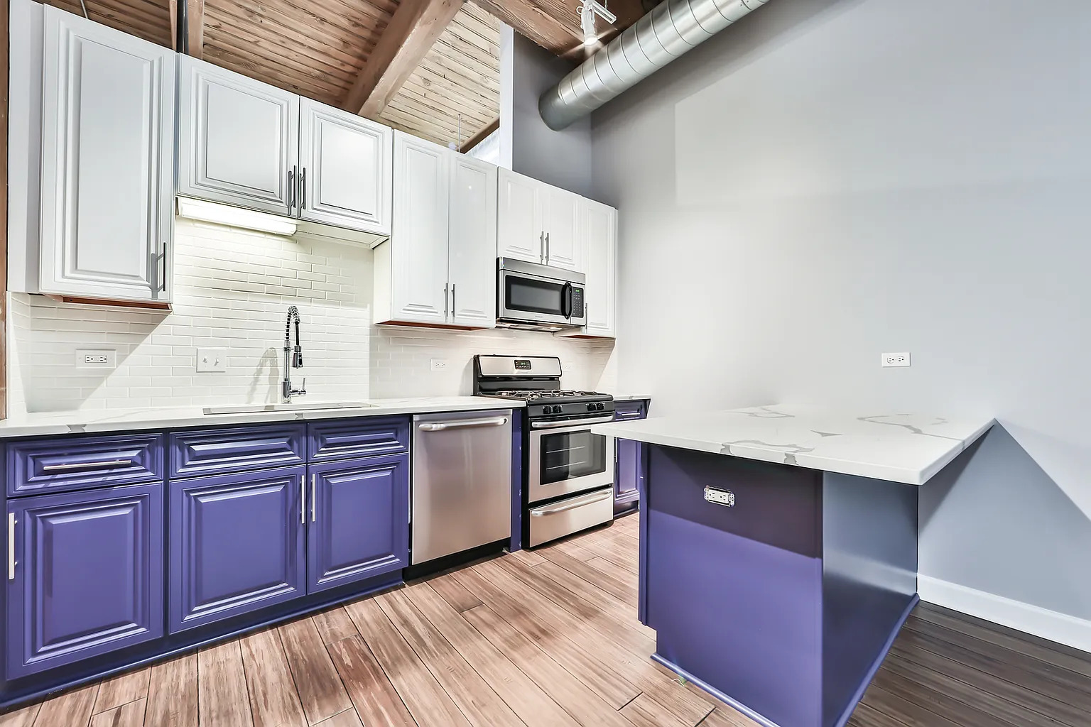 1500 West Monroe Street, Unit 206 Chicago, IL 60607 - Photo 5 of 7 a kitchen with stainless steel appliances granite countertop a sink stove and microwave