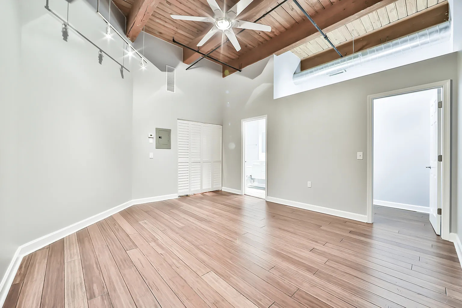 1500 West Monroe Street, Unit 206 Chicago, IL 60607 - Photo 6 of 7 a view of an empty room with wooden floor