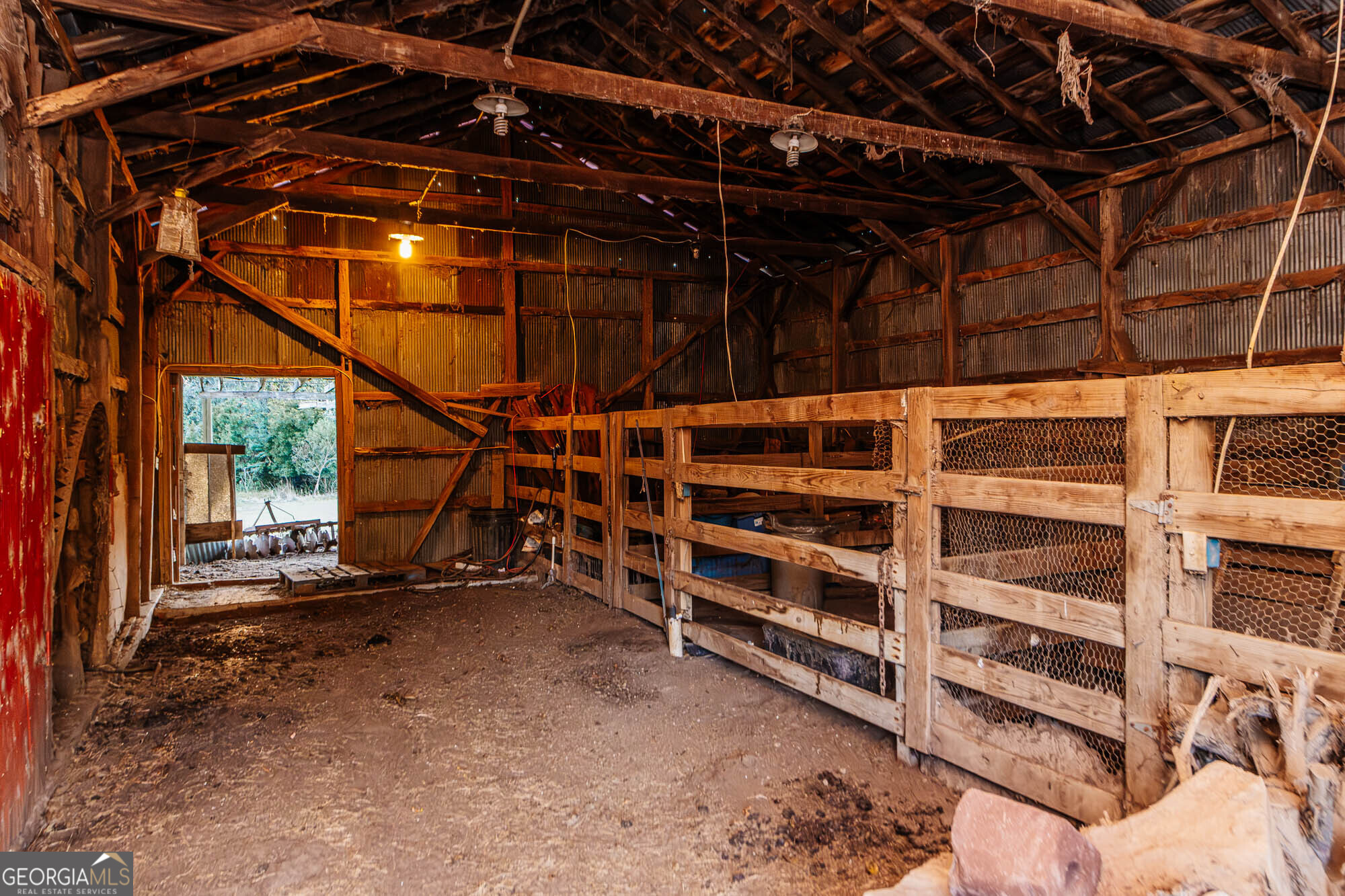 200 Felton Road Perry, GA 31069 - Photo 101 of 128 a view of an empty room with wooden shelves