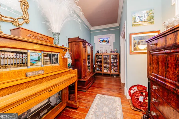 a view of a dining room with furniture and a chandelier
