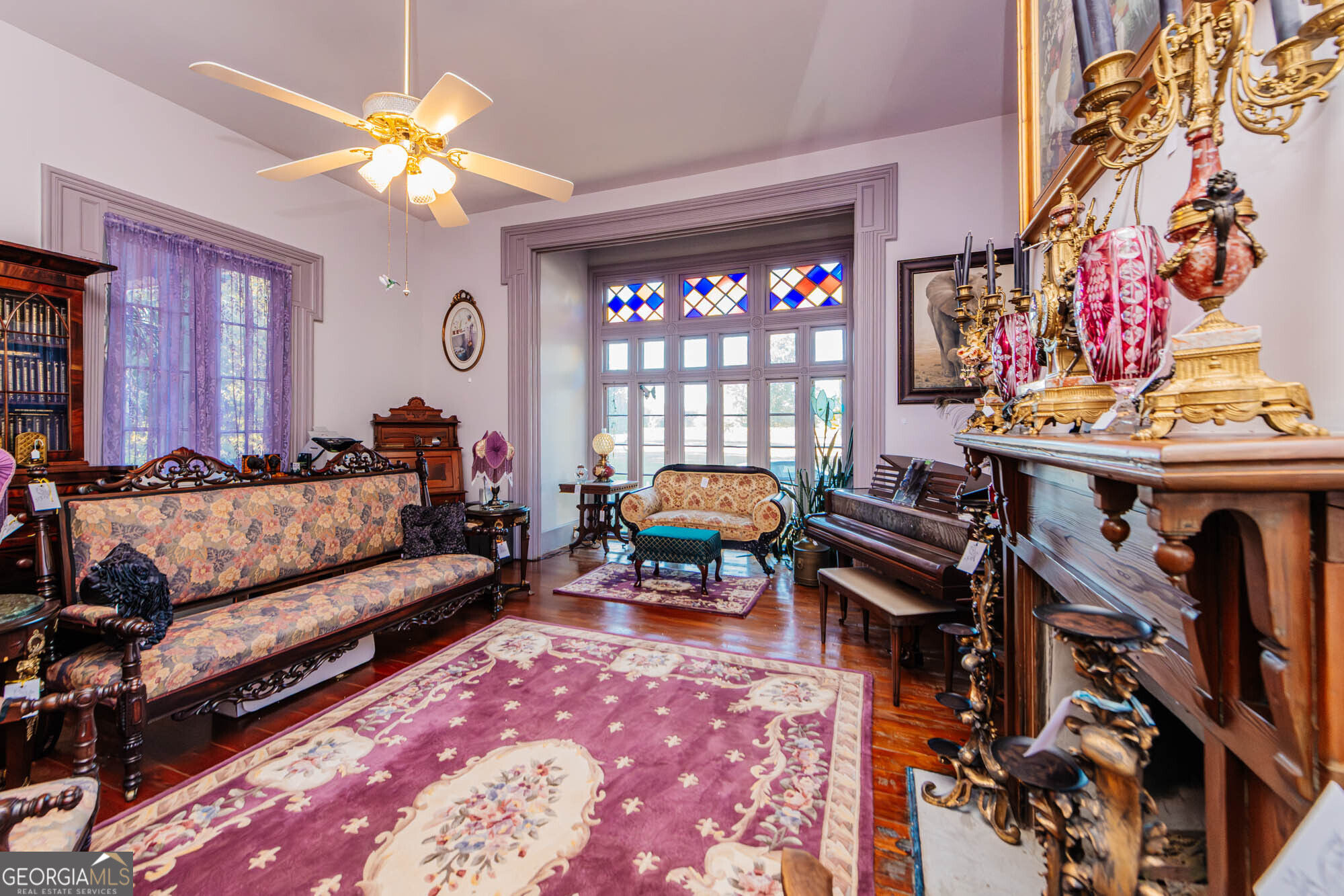 200 Felton Road Perry, GA 31069 - Photo 17 of 128 a living room with furniture a chandelier and a dining table