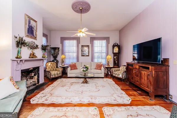 a living room with furniture and a rug