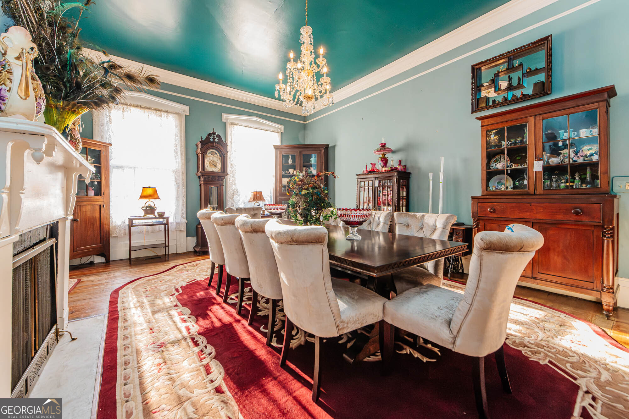 200 Felton Road Perry, GA 31069 - Photo 27 of 128 a view of a dining room with furniture a chandelier and wooden floor