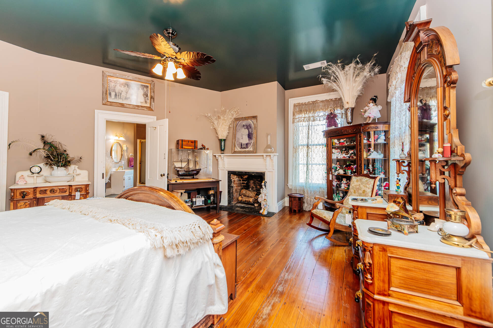 200 Felton Road Perry, GA 31069 - Photo 40 of 128 a bed room with a bed and a fireplace