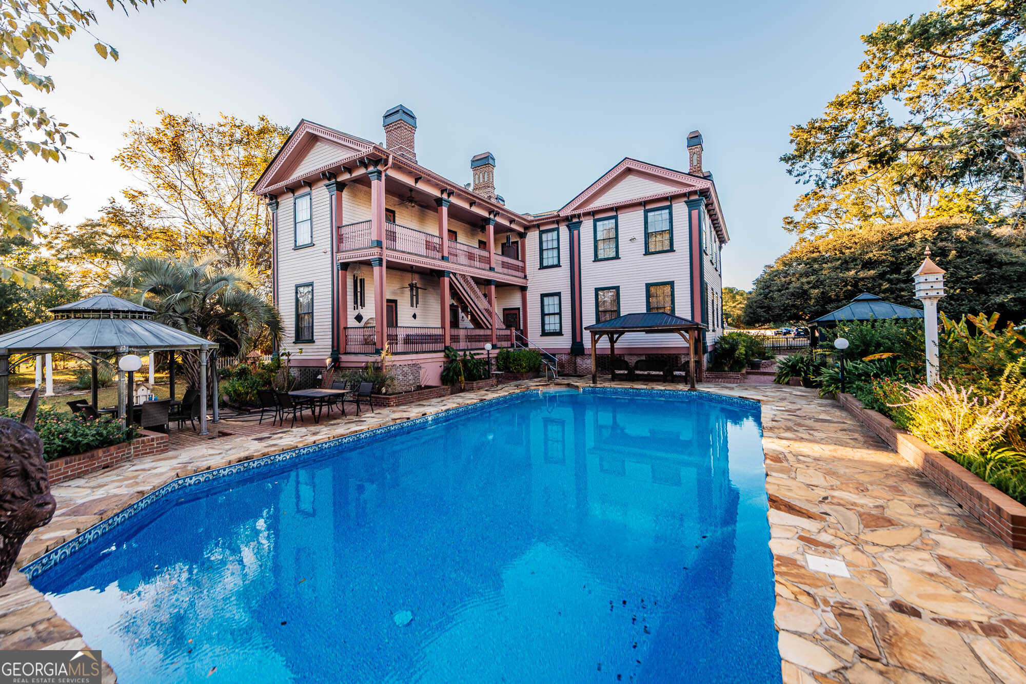 200 Felton Road Perry, GA 31069 - Photo 74 of 128 a front view of a house with swimming pool having outdoor seating
