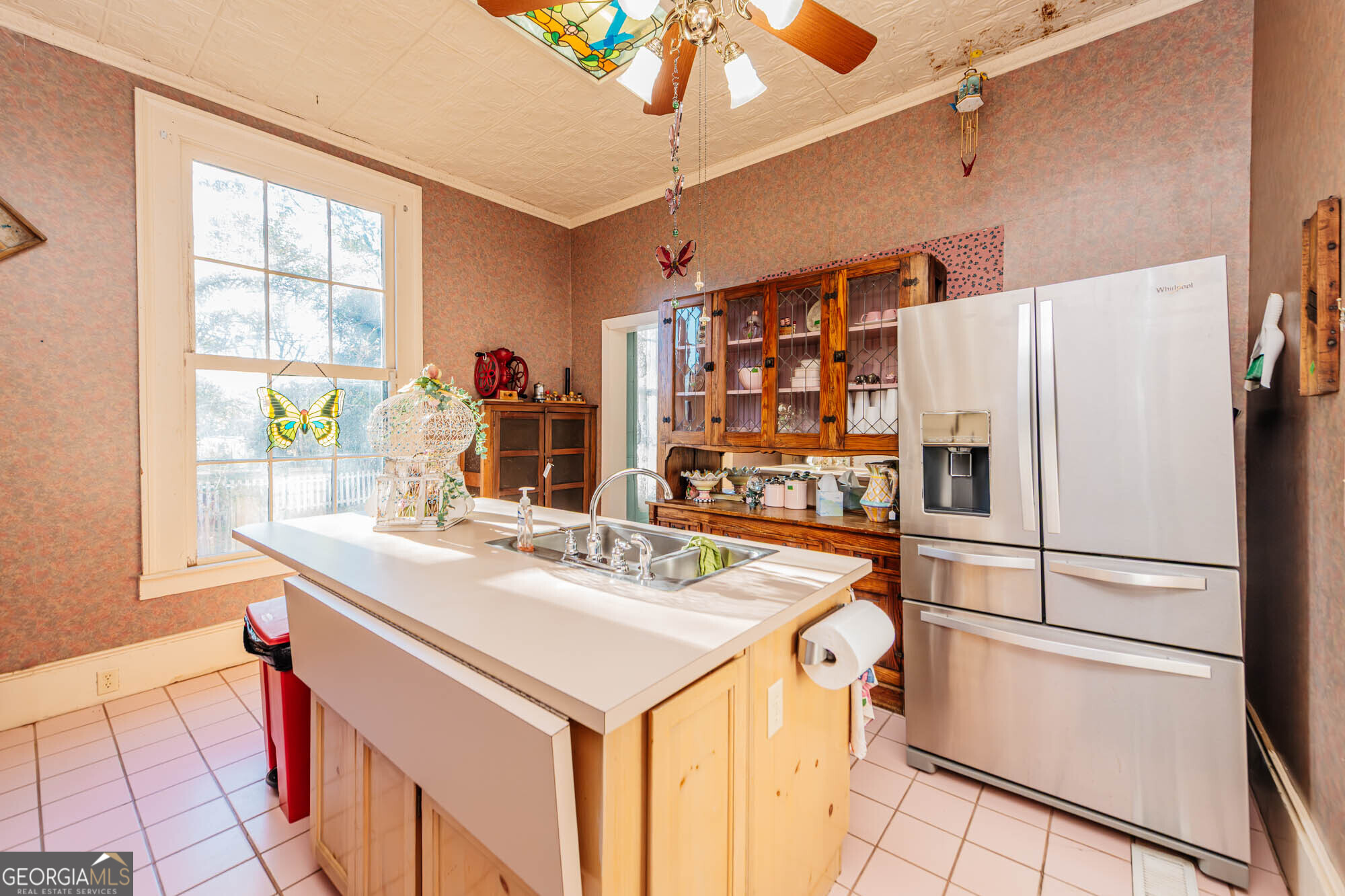 200 Felton Road Perry, GA 31069 - Photo 8 of 128 a kitchen with a refrigerator a stove a sink and a dining table