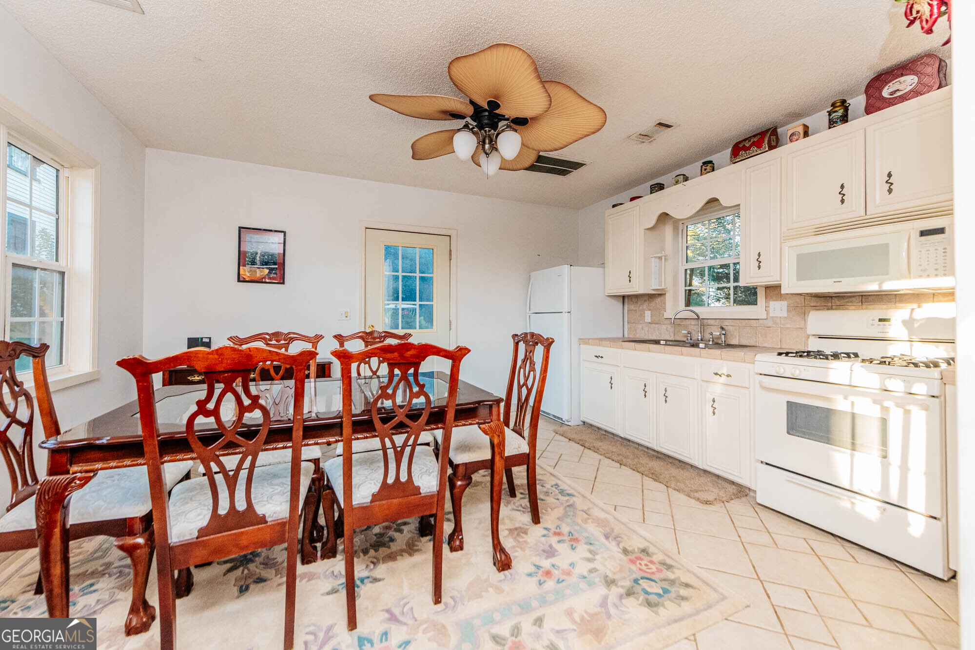 200 Felton Road Perry, GA 31069 - Photo 83 of 128 a view of a dining room with furniture and a chandelier