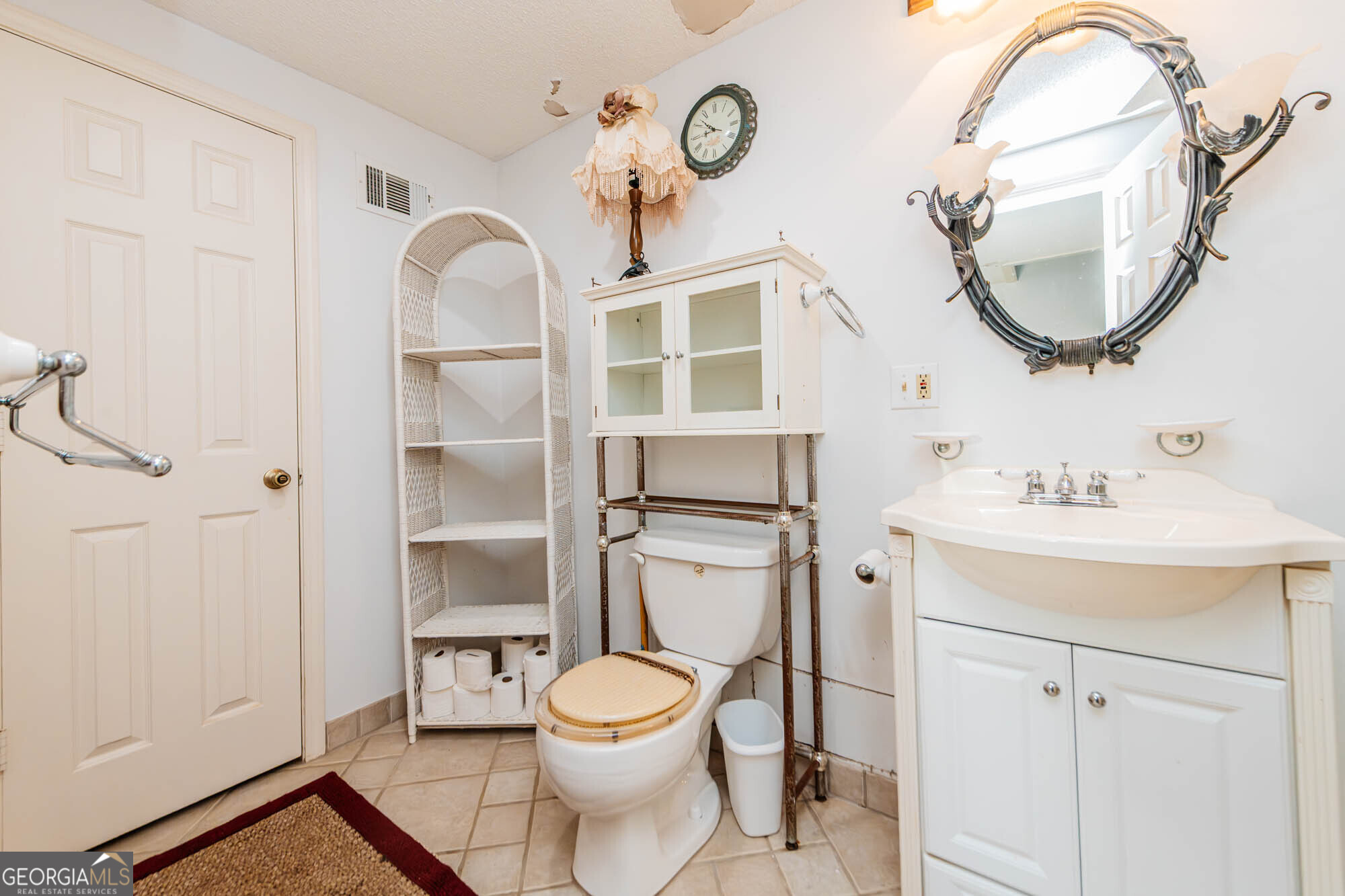 200 Felton Road Perry, GA 31069 - Photo 84 of 128 a bathroom with a toilet a sink and mirror
