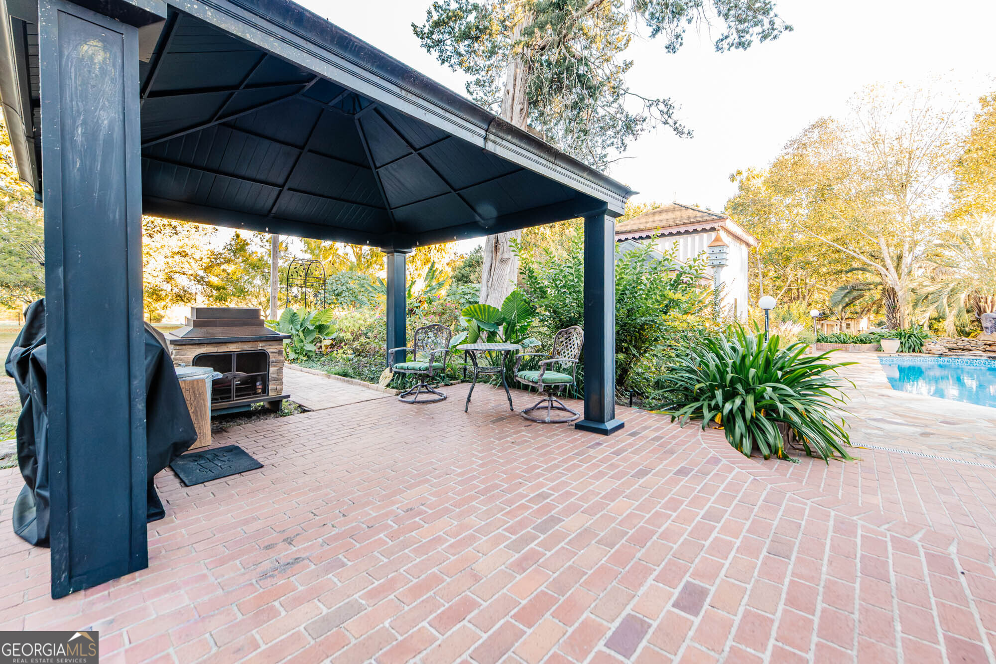 200 Felton Road Perry, GA 31069 - Photo 90 of 128 a view of backyard with plants and barbeque oven