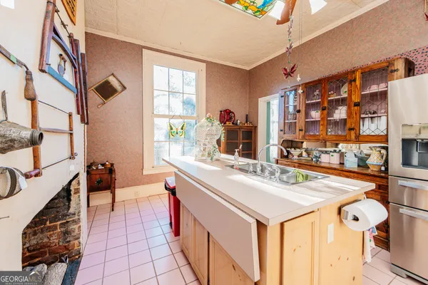 a living room with furniture a fireplace and window