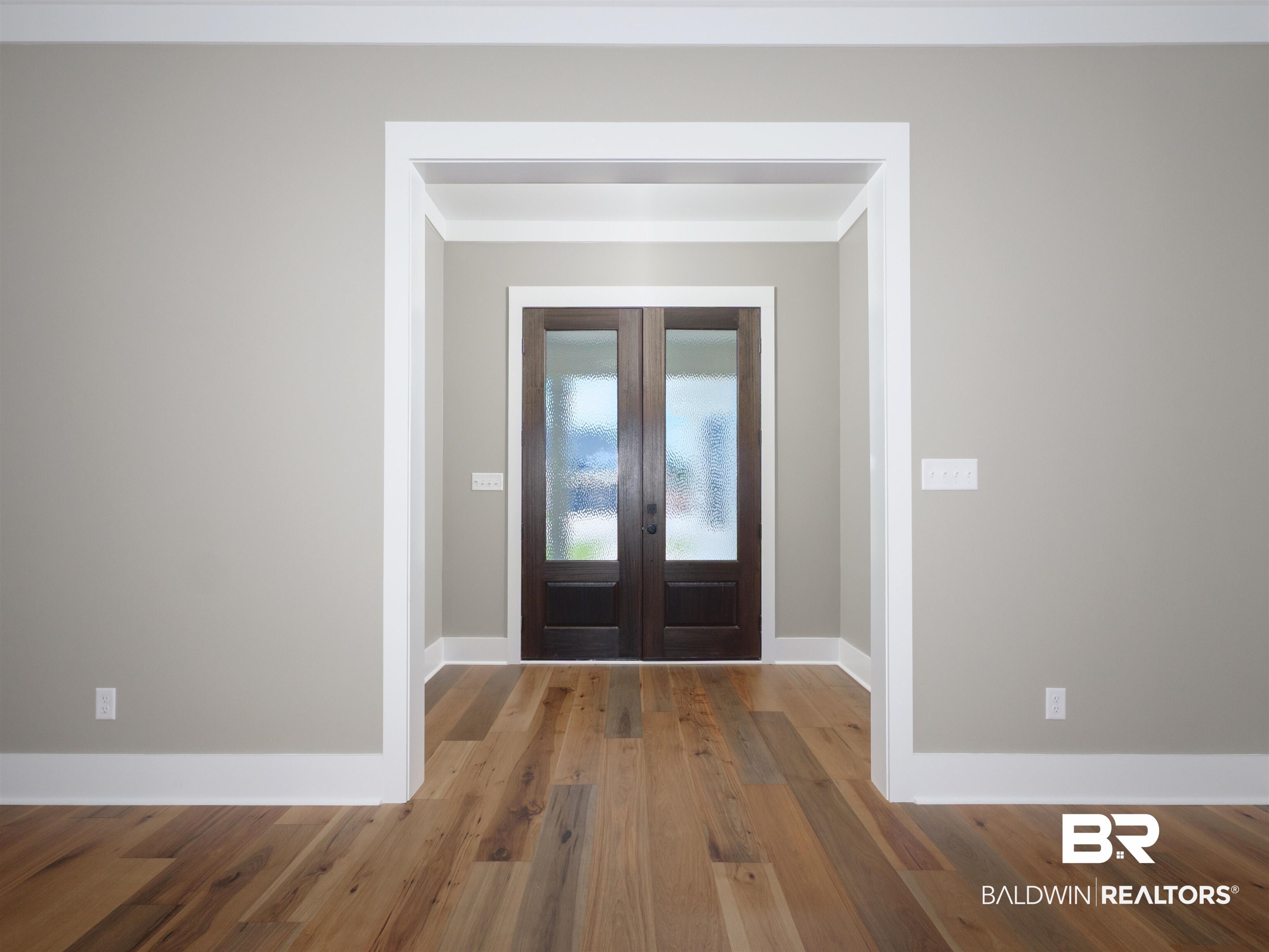 10970 Turin Avenue Fairhope, AL 36532 - Photo 3 of 61 Foyer entrance with french doors, wood finished floors, and crown molding