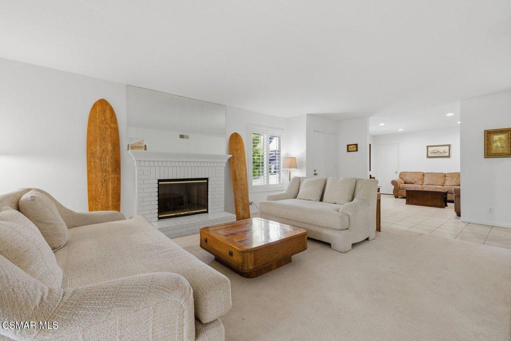 19137 Index Street, Unit 9 Porter Ranch, CA 91326 - Photo 18 of 39 a living room with furniture and a fireplace