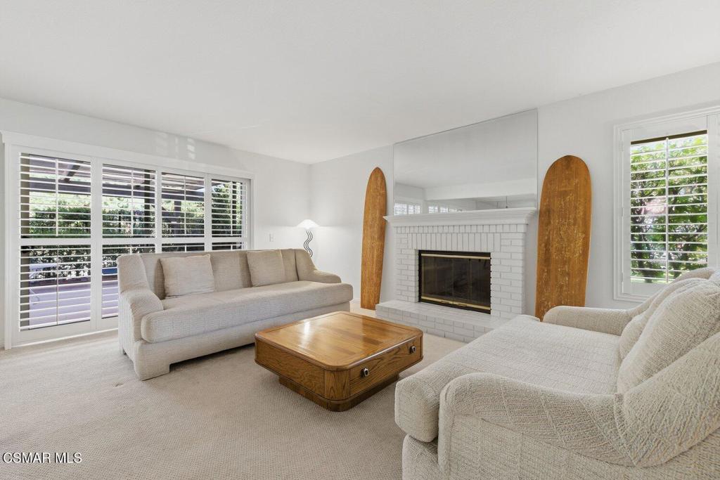 19137 Index Street, Unit 9 Porter Ranch, CA 91326 - Photo 19 of 39 a living room with furniture and a fireplace