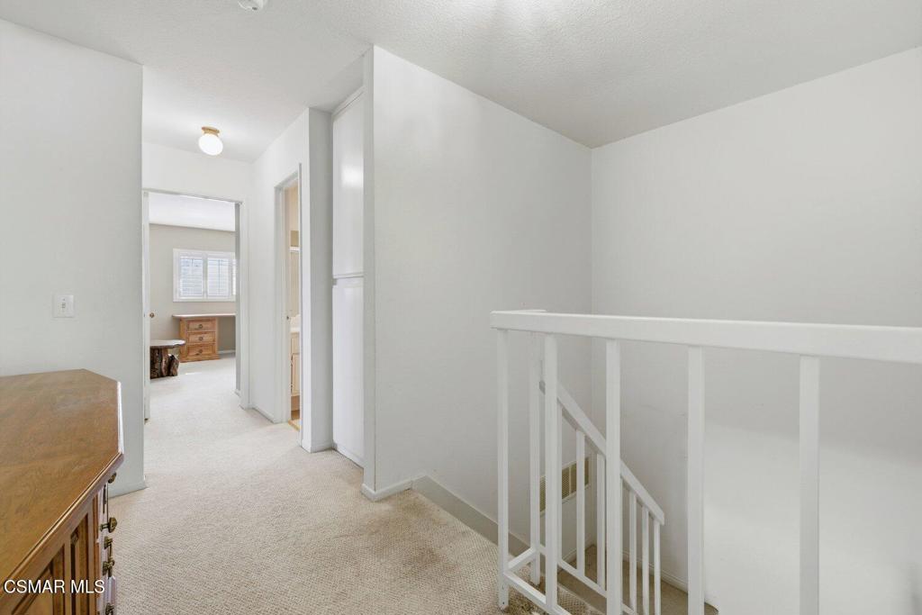 19137 Index Street, Unit 9 Porter Ranch, CA 91326 - Photo 22 of 39 a view of a hallway with an empty room and workspace