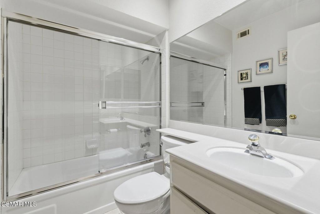 19137 Index Street, Unit 9 Porter Ranch, CA 91326 - Photo 23 of 39 a bathroom with a bathtub shower sink vanity and toilet
