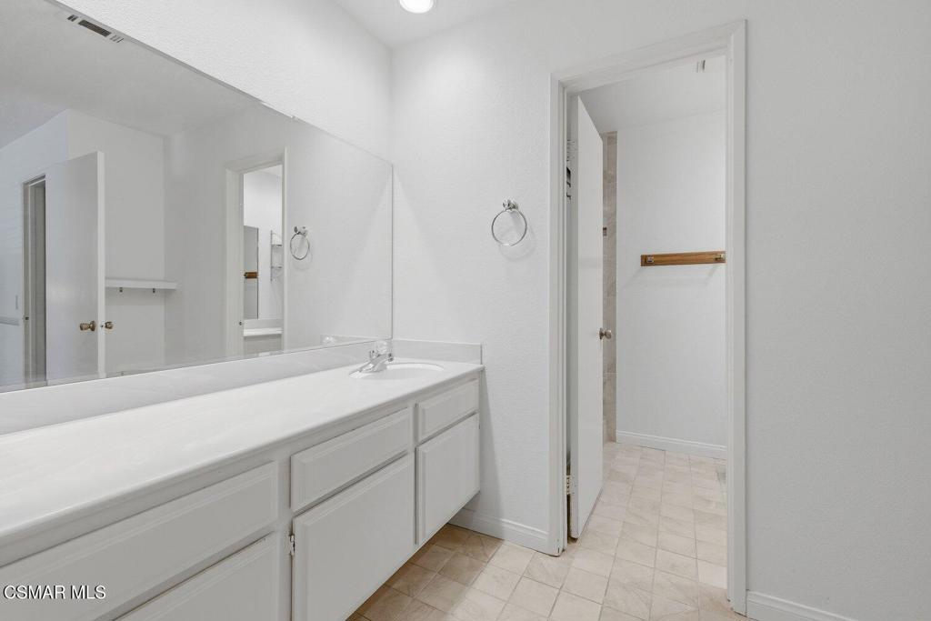 19137 Index Street, Unit 9 Porter Ranch, CA 91326 - Photo 25 of 39 a bathroom with a sink and a mirror