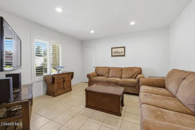 a living room with furniture and a couch