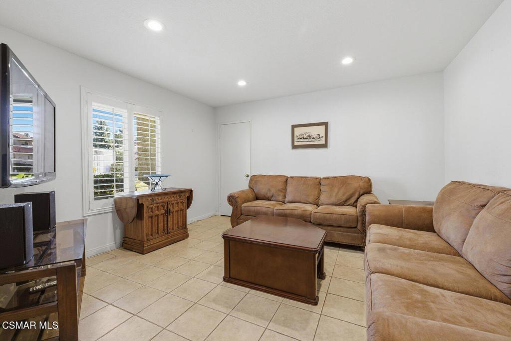 19137 Index Street, Unit 9 Porter Ranch, CA 91326 - Photo 27 of 39 a living room with furniture and a flat screen tv
