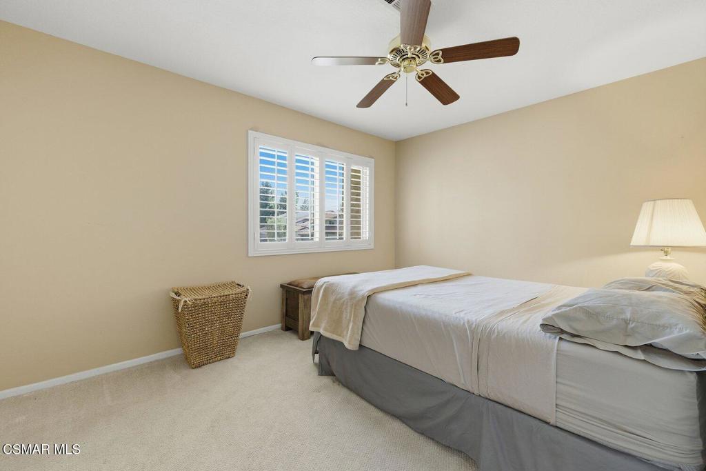 19137 Index Street, Unit 9 Porter Ranch, CA 91326 - Photo 29 of 39 a bedroom with a bed dresser and a window