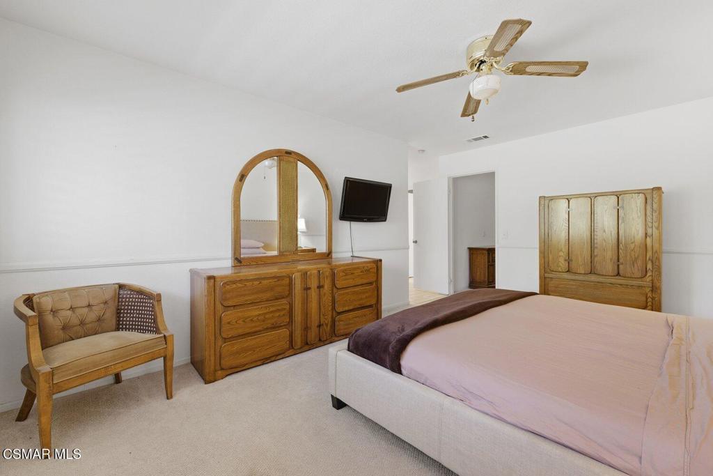 19137 Index Street, Unit 9 Porter Ranch, CA 91326 - Photo 30 of 39 a bedroom with a bed and furniture