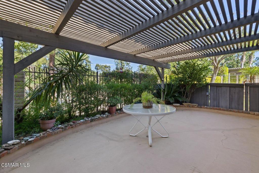 19137 Index Street, Unit 9 Porter Ranch, CA 91326 - Photo 7 of 39 a view of a chairs and table in backyard of the house