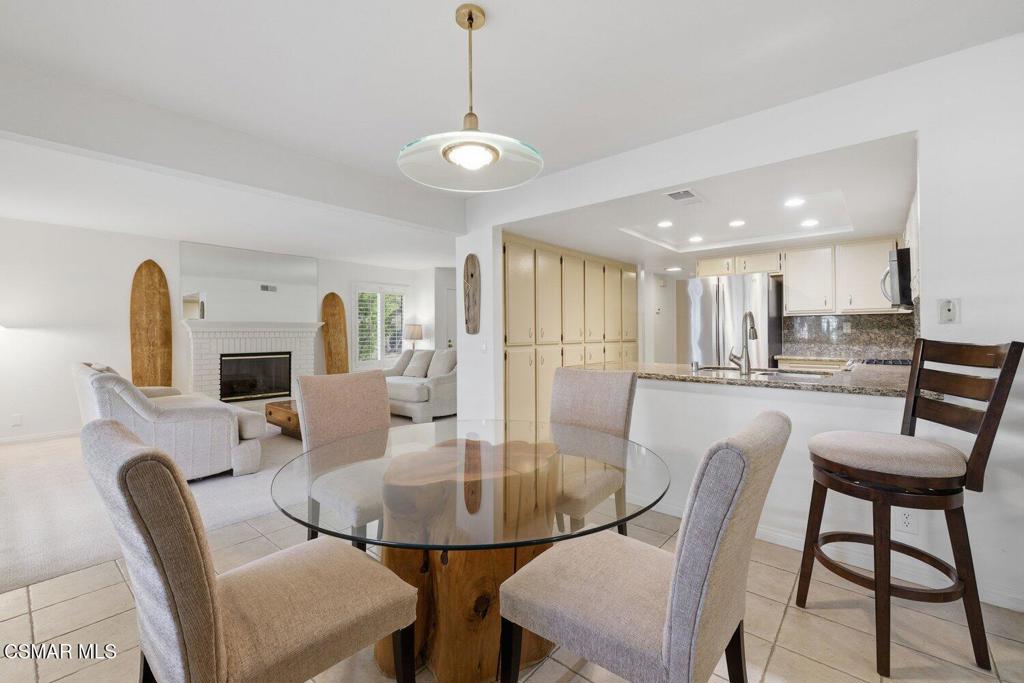 19137 Index Street, Unit 9 Porter Ranch, CA 91326 - Photo 8 of 39 a view of a dining room with furniture and wooden floor