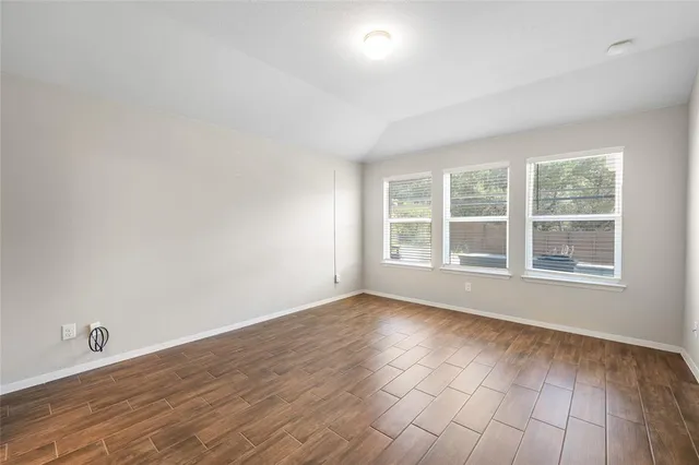 a view of a kitchen with a sink and a refrigerator